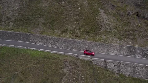 Forest Road Top View Europe Red Car Moving Up The Alps Aerial Footage Video stock 252151785