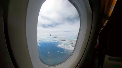 Forest, sky, cloud view from airplane window seat Stock Footage 293775356