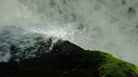 Forest Stream - Water cascading over waterfall lip - Slow Motion Stock Footage 244362042