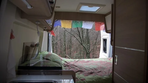 Forest view through interior of a camper van Stock Footage 98040406