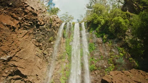 Forest waterfall spilling over rocks in forest Stock Footage 152798828