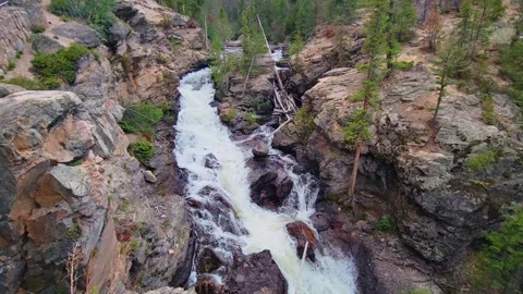 Forest waterfall view evocative of Rocky Mountain National Park, with cascading 動画素材 334104779