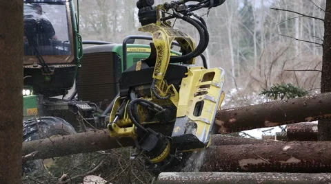 Forest work. Wood cutting machine in snow. different angles. Stock Footage 40360370