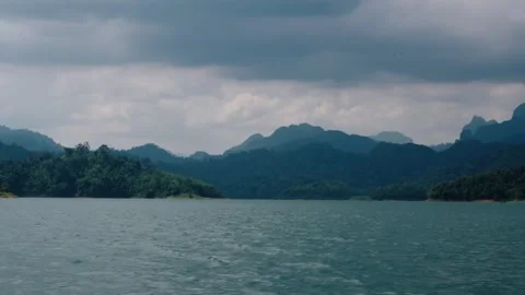 Forested Mountain Ridges Along Cheow Lan Lake Of Khao Sok National Park In Vídeo Stock 303976554