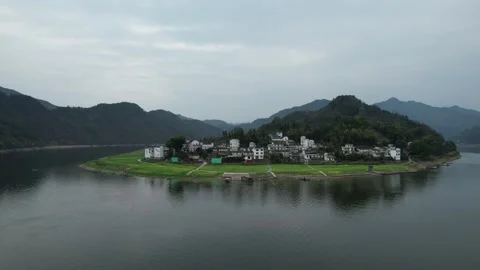 Forested Peninsula Surrounded By Mountain Lake in Qiandao Lake, China Stock Footage 344038731