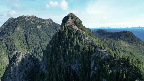 A forested Ridge leads to the Summit, Mountain, Drone Stock Footage 289565968