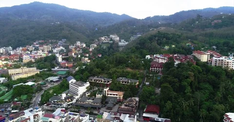 Forested ridges above the low rise sprawl of Patong Видео 71297623
