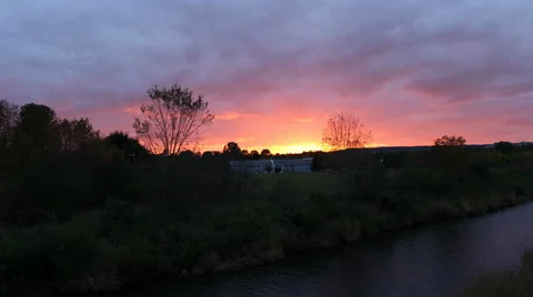 Forested Riverside Sunset Timelapse Stock Footage 64368809