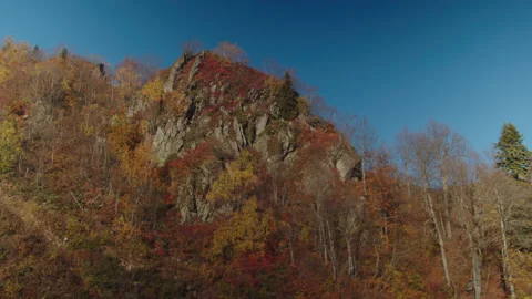 Forested rock of caucasian mountain range painted in autumn colours. there is Stock Footage 204047218