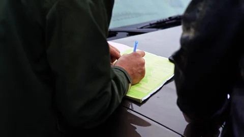 Forester Writing Sheet of Paper From Back Close Up Detail 스톡 동영상 128491701