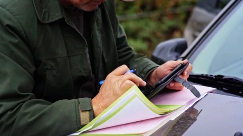 Forester Writing Sheet of Paper From Side Close Up Detail 스톡 동영상 128491710