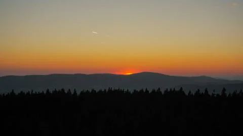 Forests, mountains and sunset Stock Photos