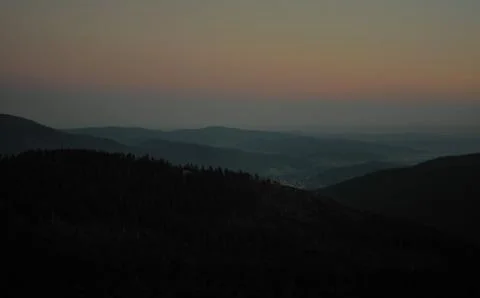 Forests, mountains and sunset Stock Photos