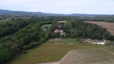 Forests, tiny lake and farm fields in the mountains in South of France Landscape Stock Footage 194569844