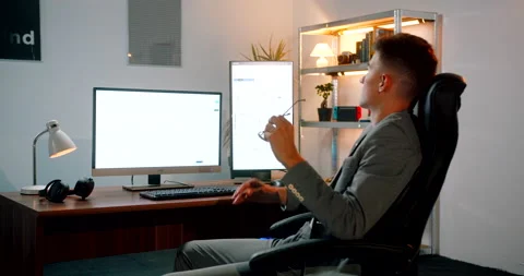 Forex daytrader with glasses working in his office Stock Footage 160977984