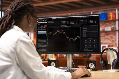 Forex trader browsing though stock exchange portfolio shares on computer screen Stock-Fotos