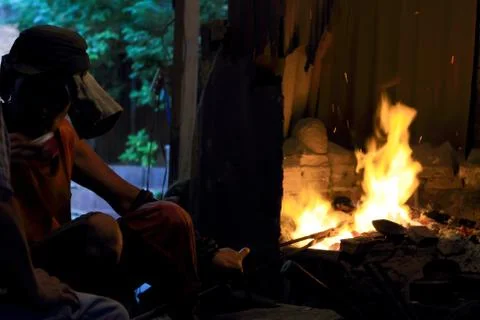 Forge fire in blacksmith's where iron tools are crafted Stock Photos