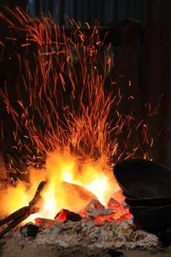 Forge fire in blacksmith's where iron tools are crafted Stock Photos
