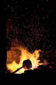 Forge fire in blacksmith's where iron tools are crafted Stock Photos
