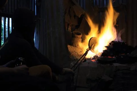 Forge fire in blacksmith's where iron tools are crafted Stock Photos