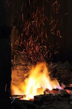 Forge fire in blacksmith's where iron tools are crafted Stock Photos