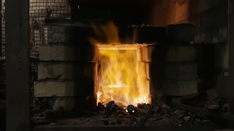 Forge fire in furnace. Blacksmith temper a steel product in a stove. Smithy f Stock Footage 121583810