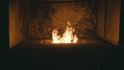 Forge fire in furnace. Blacksmith tempers a steel product in a stove. Smithy Stock Footage 121113673