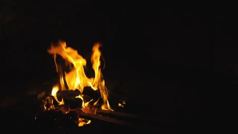 Forge fire in furnace. Blacksmith tempers a steel product in a stove. Smithy Stock Footage 121872343