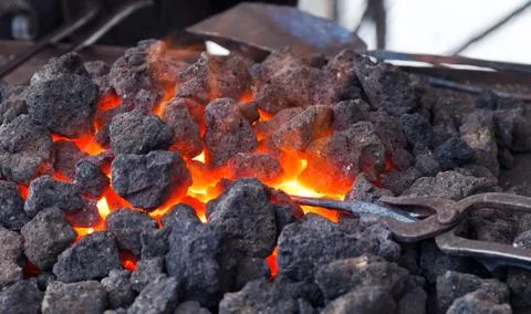 Forge with hot flaring coal Stock Photos