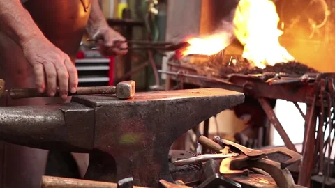 Forge welding hot iron in slow motion Stock Footage 133954693