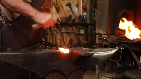 Forge Welding a strap hinge Stock Footage 153496500