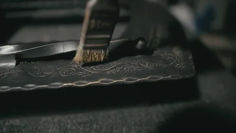 Forge workshop. The product is artificially aged. Gold powder painting of Stock Footage 121872241