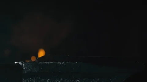 Forge workshop. Smithy manual production. Hands of smith with hammer hit on Stock Footage 117245667