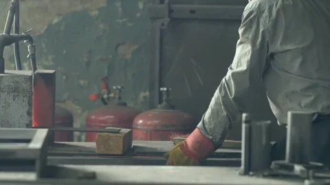 Forge workshop. Smithy manual production. Hands of smith with hammer hit on Stock Footage 117246404