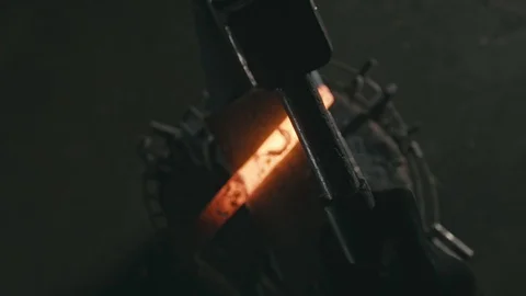 Forge workshop. Smithy manual production. Hands of smith with hammer hit on Stock Footage 121080673
