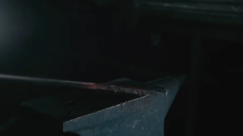 Forge workshop. Smithy manual production. Hands of smith with hammer hit on Stock Footage 121113757