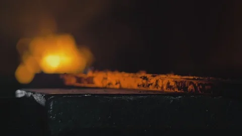 Forge workshop. Smithy manual production. Hands of smith with hammer hit on Stock Footage 121271843
