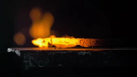 Forge workshop. Smithy manual production. Hands of smith with hammer hit on Stock Footage 121410340