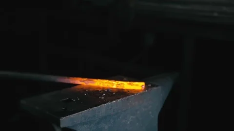 Forge workshop. Smithy manual production. Hands of smith with hammer hit on Stock Footage 121410347