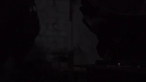 Forge workshop. Smithy. Worker in a welding hood helmet welds a part by electric Stock Footage 121000761