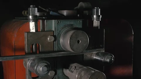 Forge workshop on table. Worker bends the metal rod on the wrought iron round Stock Footage 117664273