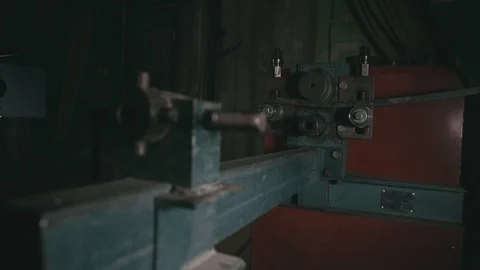 Forge workshop on table. Worker bends the metal rod on the wrought iron round Stock Footage 120657155