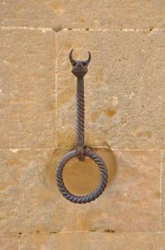 Forged decorative wall bracket knocker Stock Photos