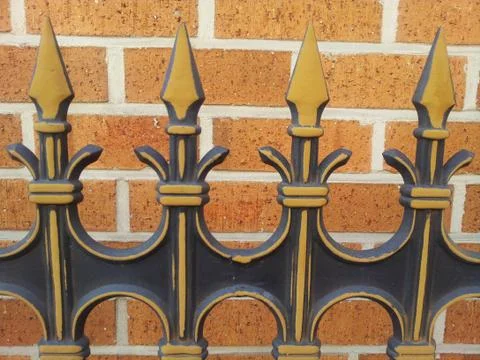 Forged elements of decorative processing of metal fence Stock Photos