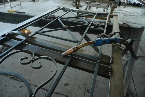 Forged gates created by a master. Stock Photos