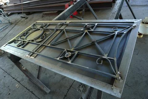 Forged gates created by a master. 스톡 사진