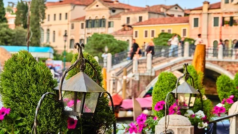 Forged lanterns on the background of gondolas and bridges over the canals of  Stock Footage 128355633