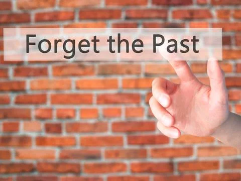 Forget the Past - Hand pressing a button on blurred background concept on vis Stock Photos