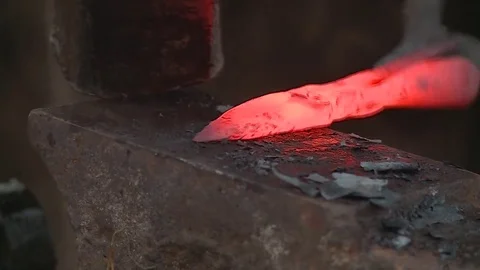 Forging an arrowhead on an anvil Stock Footage 82865322
