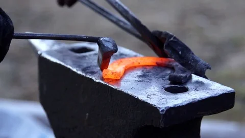Forging horseshoe in slow motion Stock Footage 77010587
